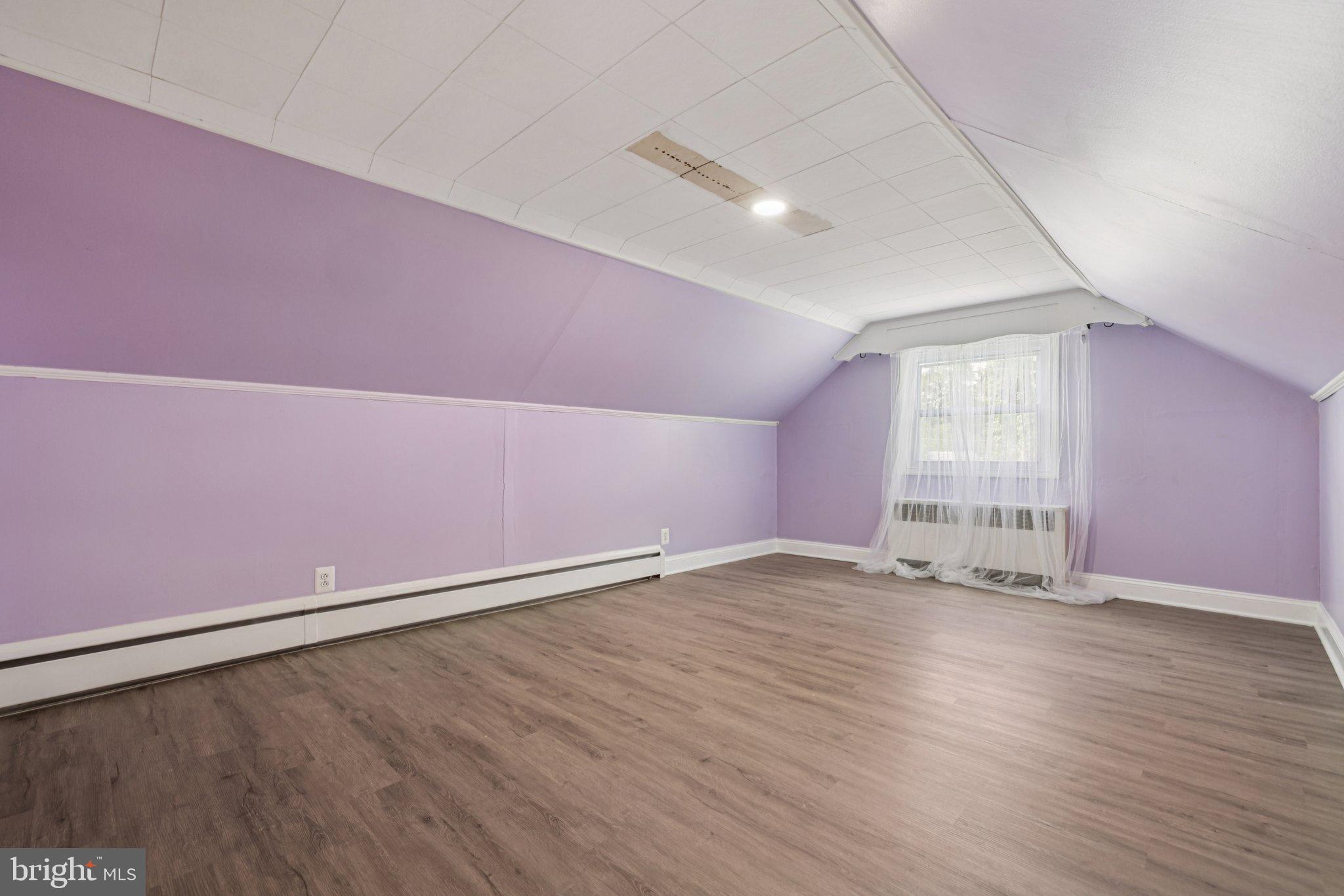 6907 Moyer Avenue Baltimore, MD 21234 - Photo 25 of 48 Charming attic space with soft lavender hues.