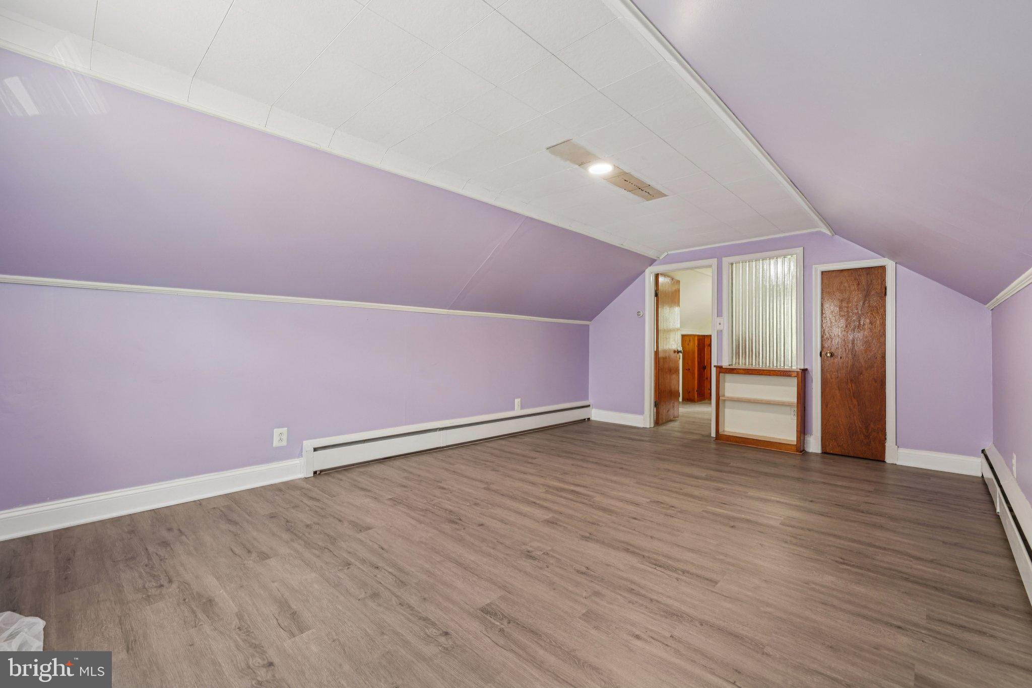 6907 Moyer Avenue Baltimore, MD 21234 - Photo 26 of 48 Charming attic space with soft lavender hues.