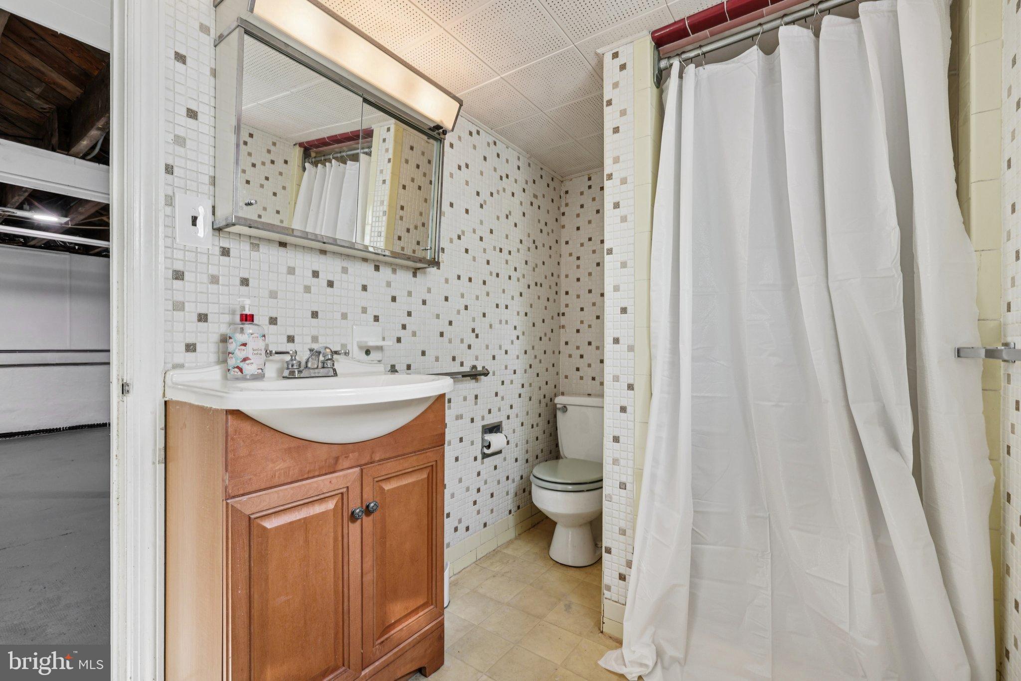 6907 Moyer Avenue Baltimore, MD 21234 - Photo 30 of 48 Charming bathroom with modern accents.