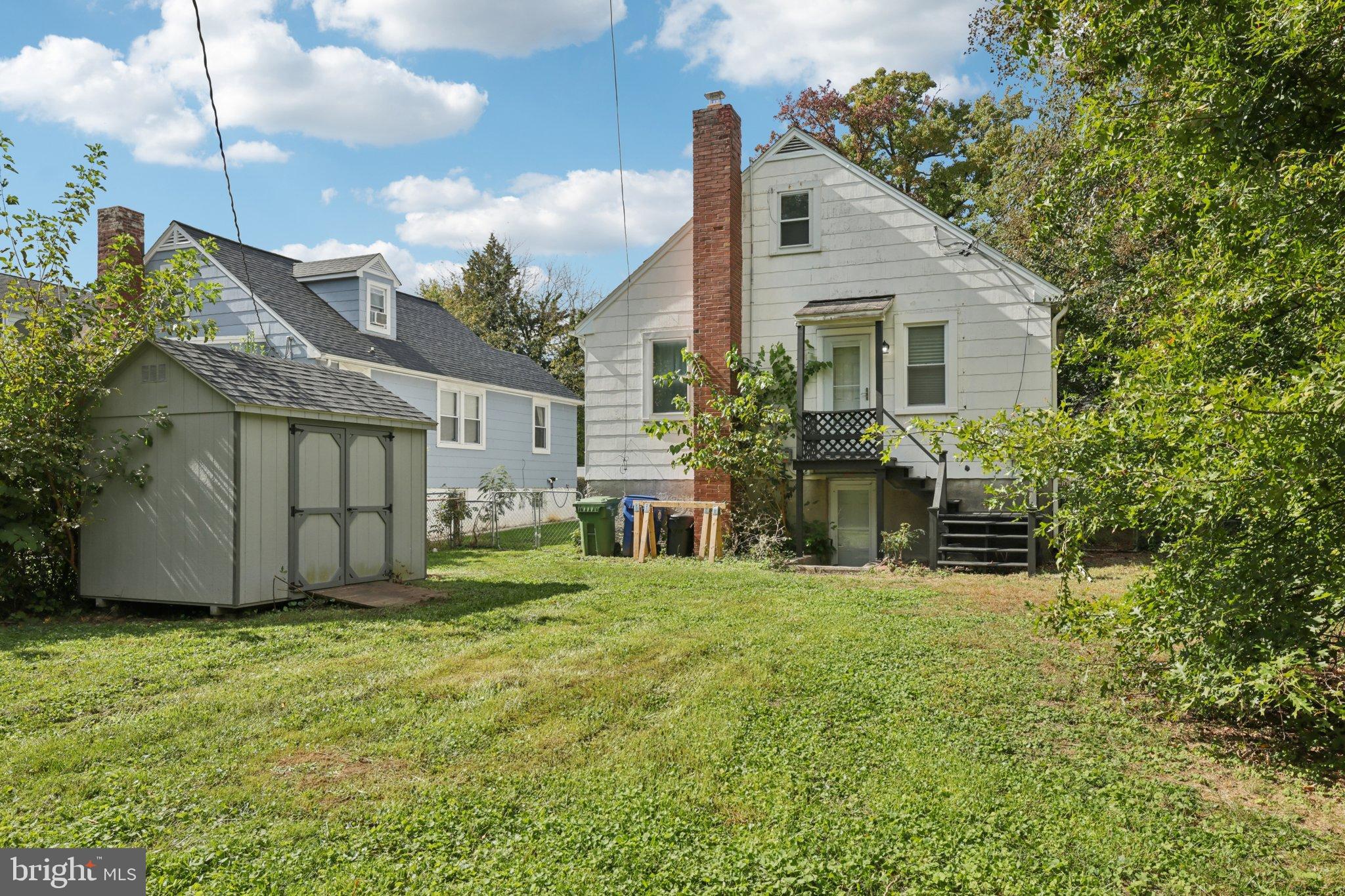 6907 Moyer Avenue Baltimore, MD 21234 - Photo 36 of 48 Charming backyard retreat with lush greenery.