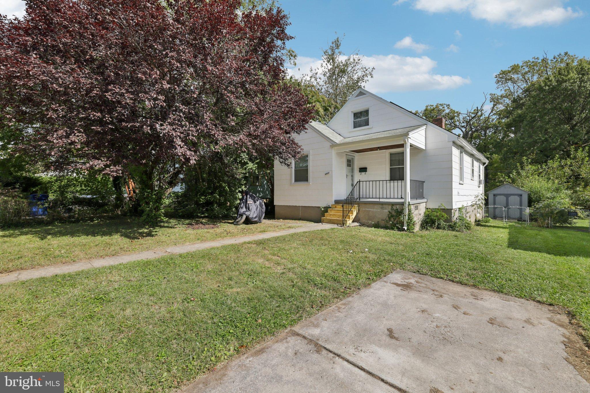 6907 Moyer Avenue Baltimore, MD 21234 - Photo 4 of 48 Charming home with lush greenery and shade.