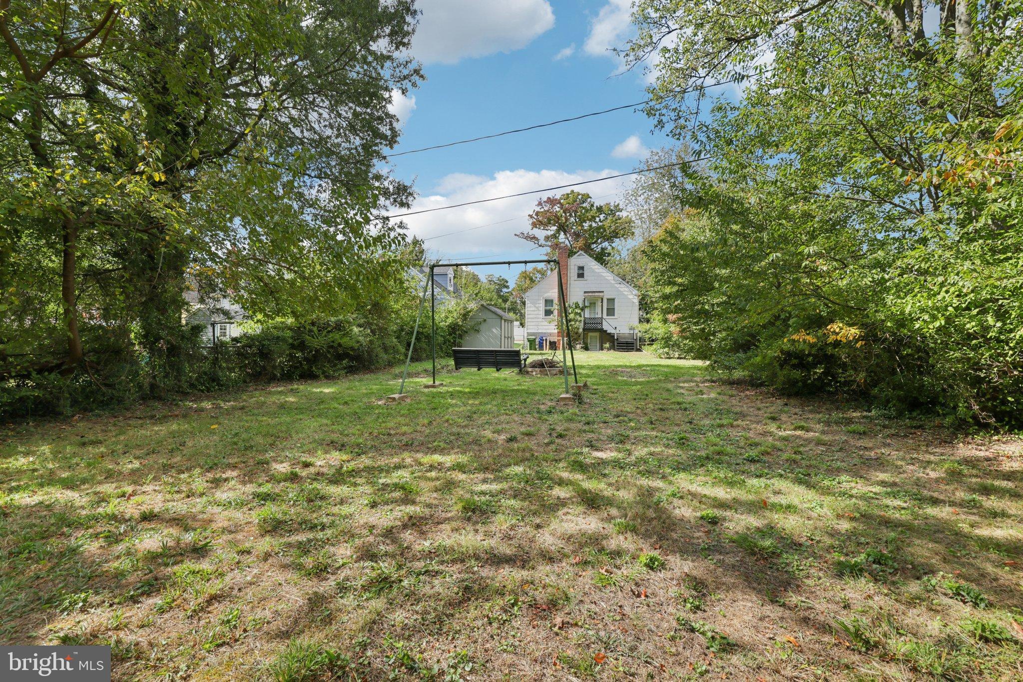 6907 Moyer Avenue Baltimore, MD 21234 - Photo 41 of 48 Spacious backyard oasis with lush greenery.