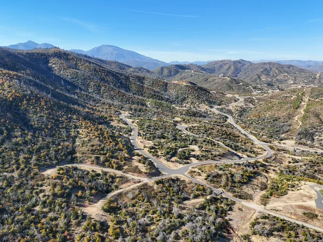 an aerial view of residential house and green space