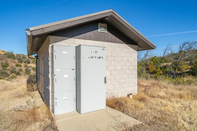 a view of a houses with a forest