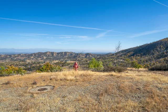 an aerial view of residential house and car parked