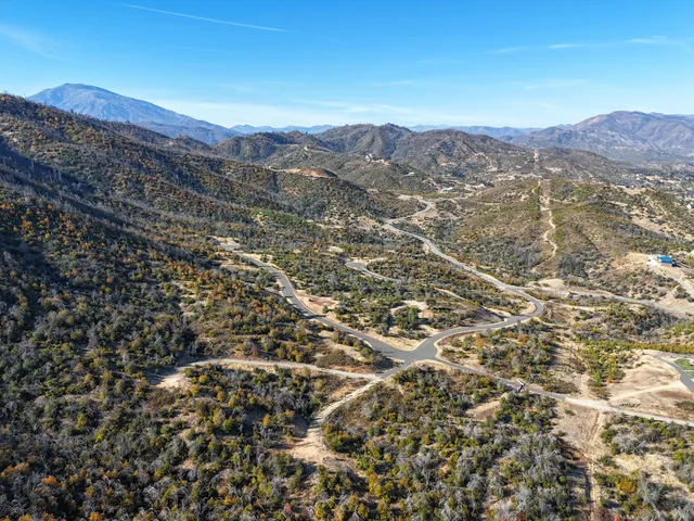 a view of a city with mountains in the background
