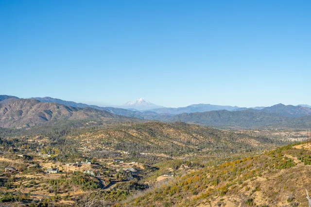 a view of a city with mountains in the background