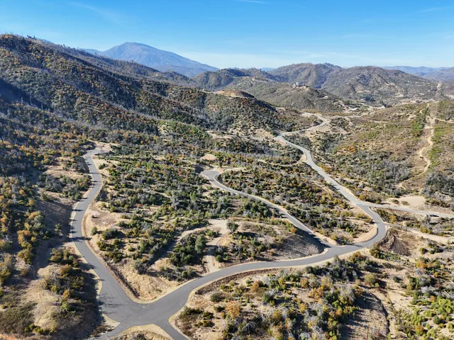 a view of a city with mountains in the background