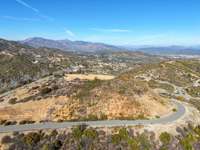 a view of a city with mountains in the background