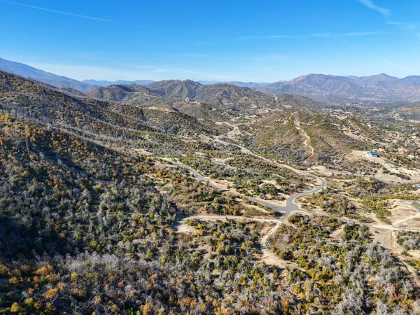 an aerial view of residential building and an ocean