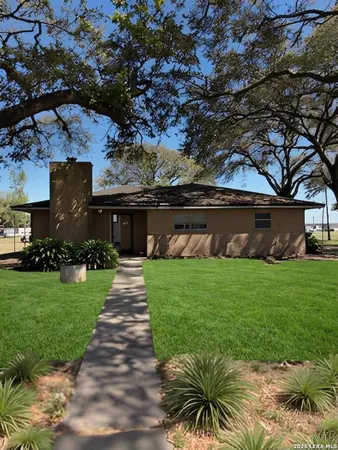 a front view of house with garden