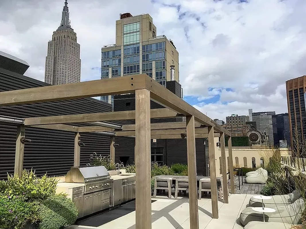 404 Park Avenue South, Unit 8/D Manhattan, NY 10016 - Photo 10 of 15 a view of a patio with table and chairs and potted plants