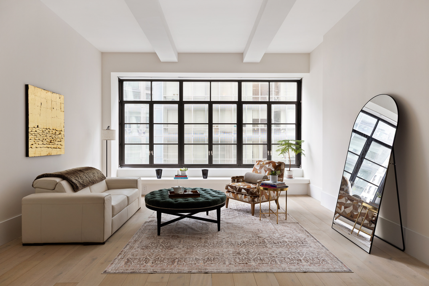 404 Park Avenue South, Unit 8/D Manhattan, NY 10016 - Photo 2 of 15 a living room with furniture and a large window
