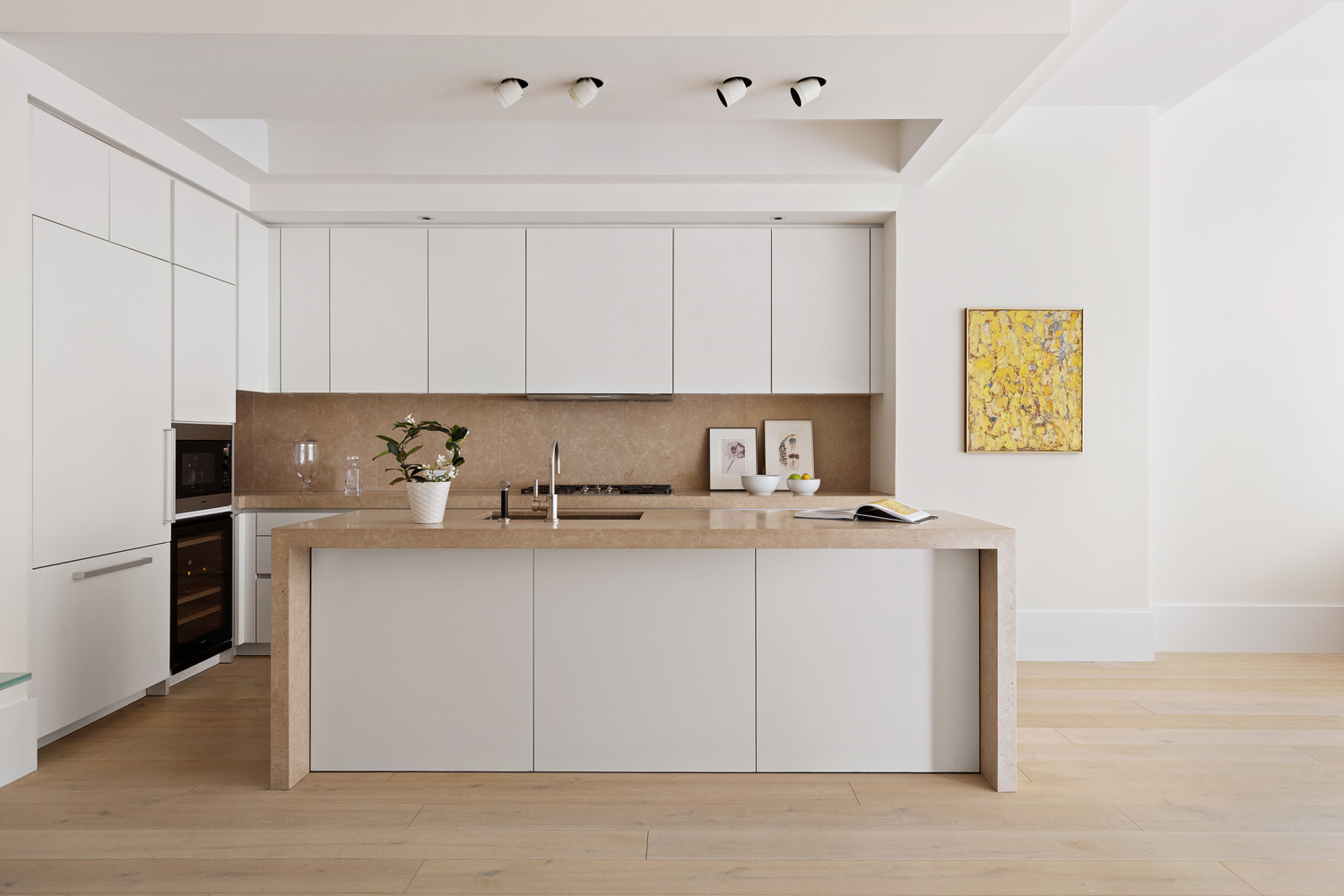 404 Park Avenue South, Unit 8/D Manhattan, NY 10016 - Photo 3 of 15 a kitchen with stainless steel appliances a sink a stove a refrigerator and cabinets