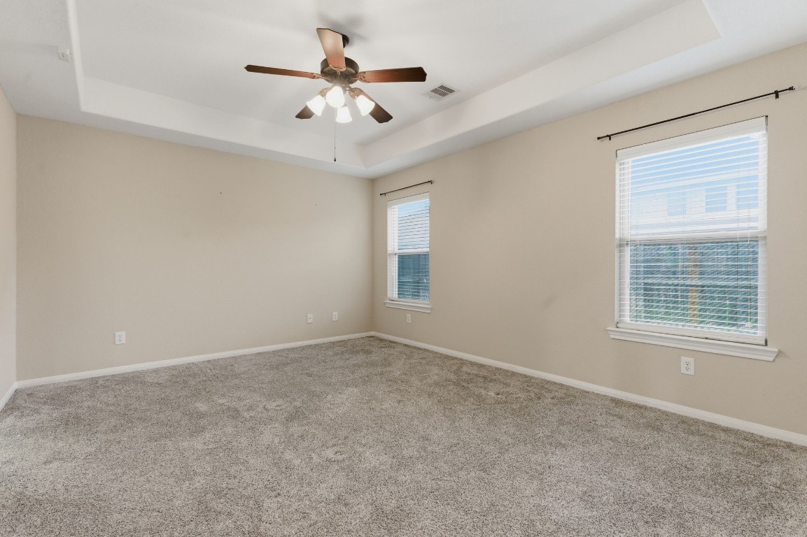 21822 Mount Hunt Drive Spring, TX 77388 - Photo 14 of 26 Luxurious Primary Suite with Elegant Tray Ceiling.