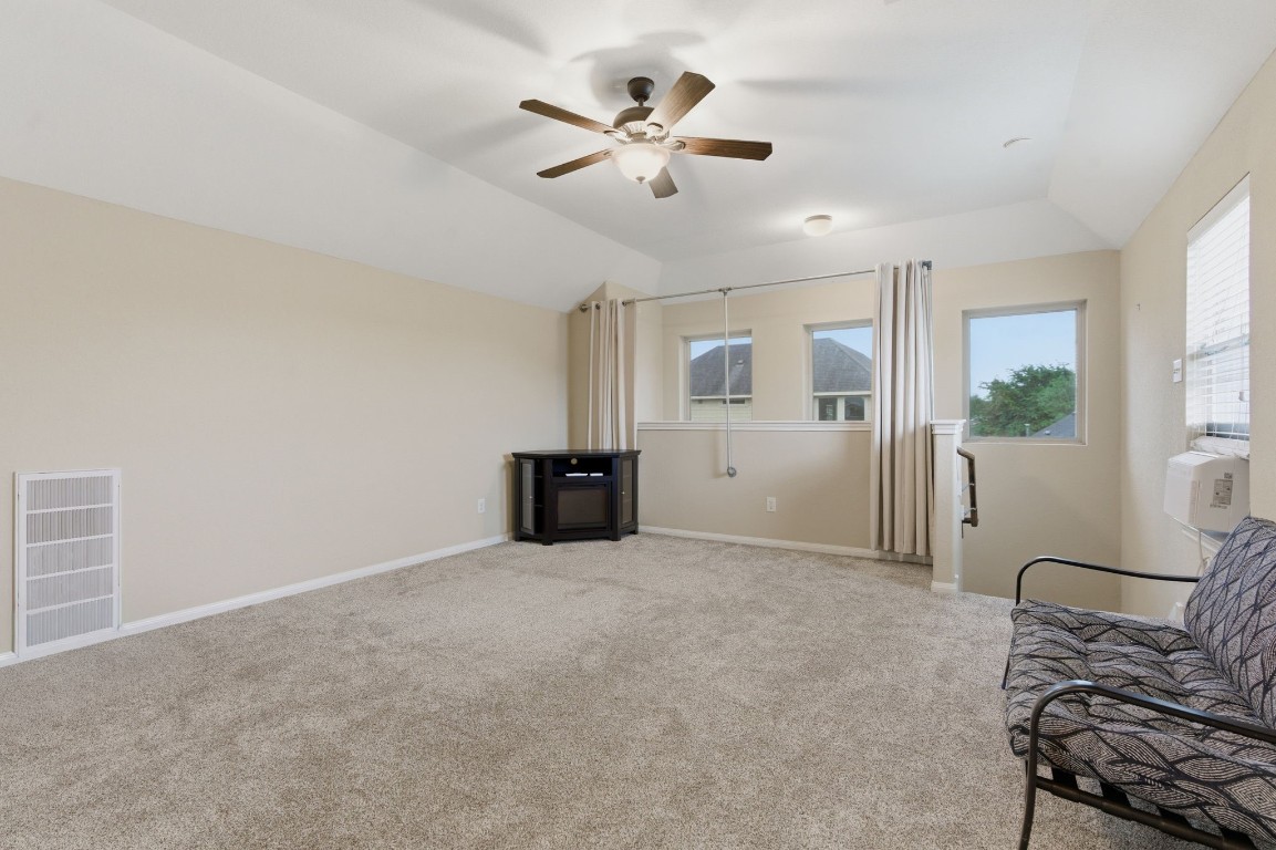 21822 Mount Hunt Drive Spring, TX 77388 - Photo 23 of 26 Inviting upstairs bonus room with a full bath—perfect for a guest suite or home office!