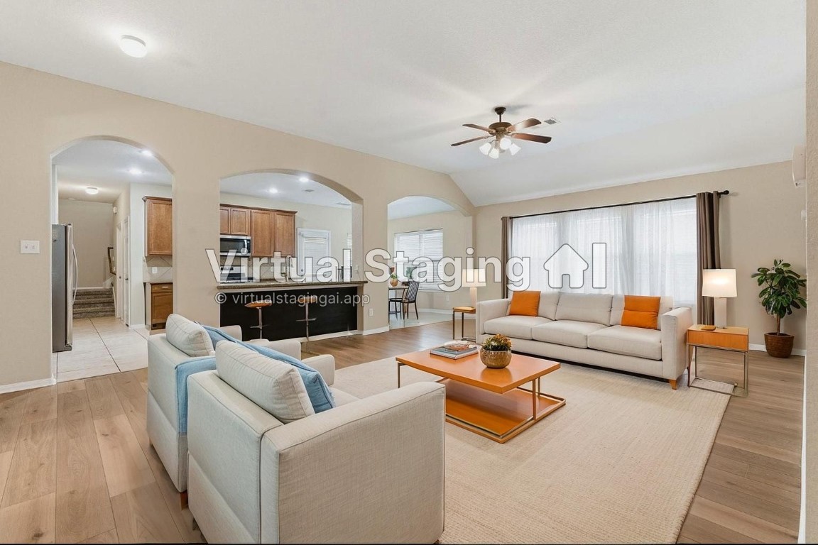 21822 Mount Hunt Drive Spring, TX 77388 - Photo 3 of 26 Inviting living area with virtual staging, showcasing spaciousness and modern elegance. Perfect for relaxation and entertaining.