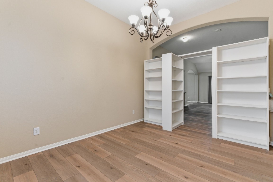 21822 Mount Hunt Drive Spring, TX 77388 - Photo 8 of 26 Elegant office entry with built-in shelving and stylish lighting, providing a welcoming and functional space.