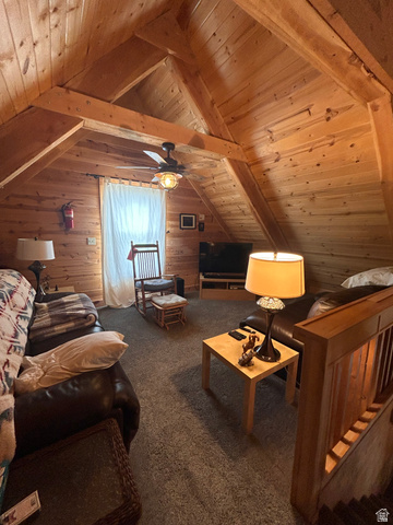 19075 West Honesty Cove Duchesne, UT 84021 - Photo 19 of 44 Attic living space featuring vaulted wood-plank ceilings, exposed wood beams, and textured carpeting