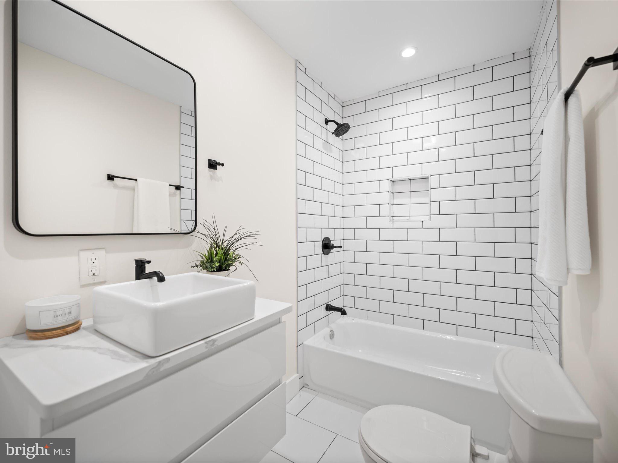 509 Randolph Street Northwest, Unit 2 Washington, DC 20011 - Photo 15 of 23 a bathroom with a sink toilet and shower