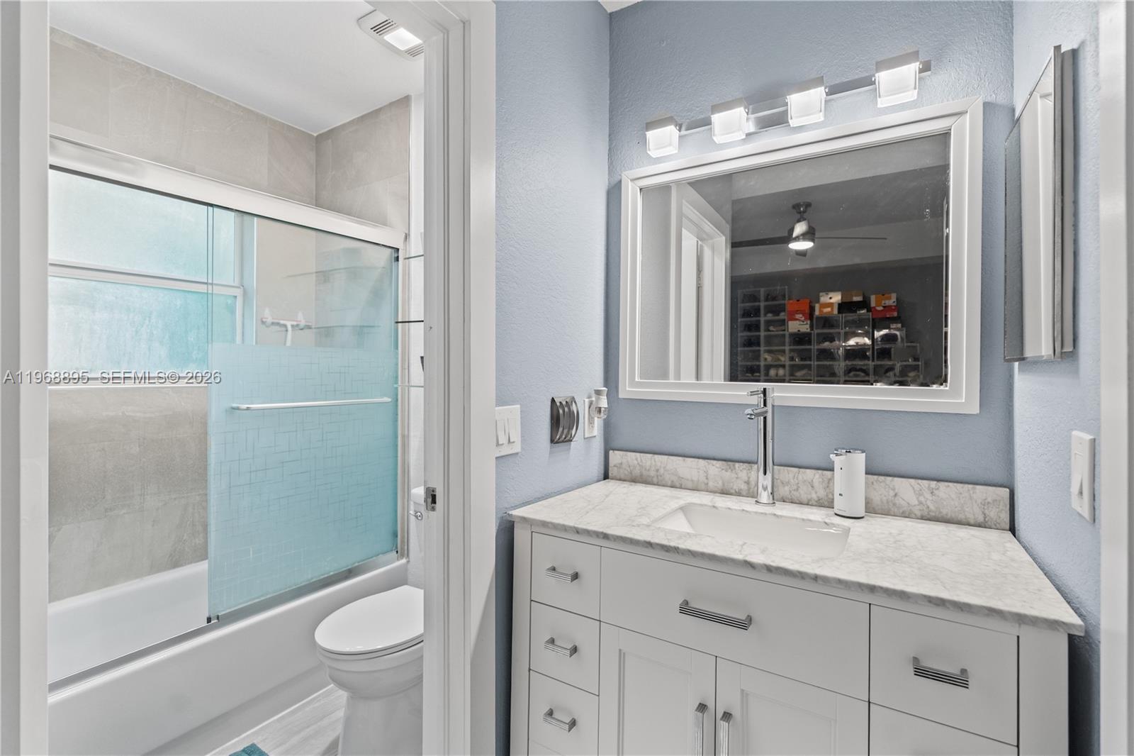 1621 Southeast 30th Street Homestead, FL 33035 - Photo 12 of 20 a bathroom with a granite countertop sink toilet and shower