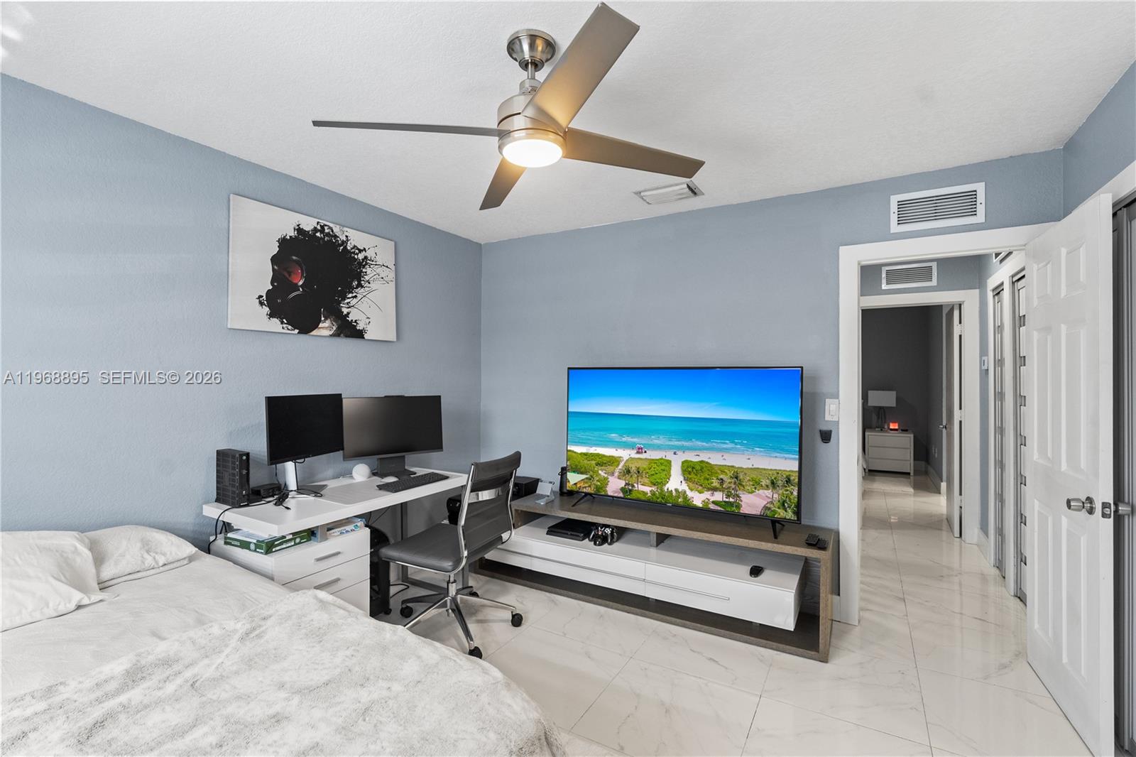 1621 Southeast 30th Street Homestead, FL 33035 - Photo 15 of 20 a bedroom with bed and a flat screen tv