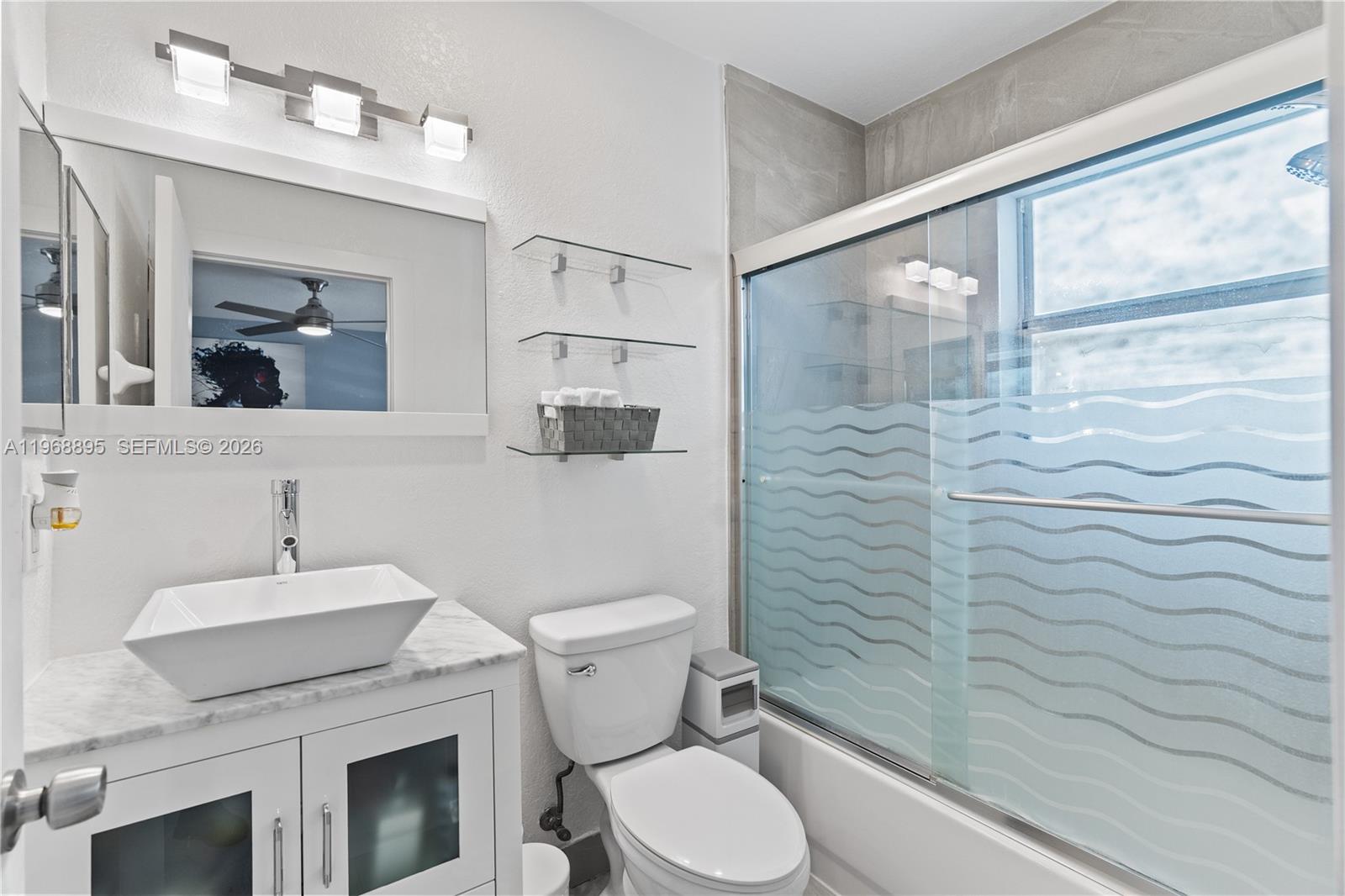 1621 Southeast 30th Street Homestead, FL 33035 - Photo 16 of 20 a bathroom with a sink a toilet and shower