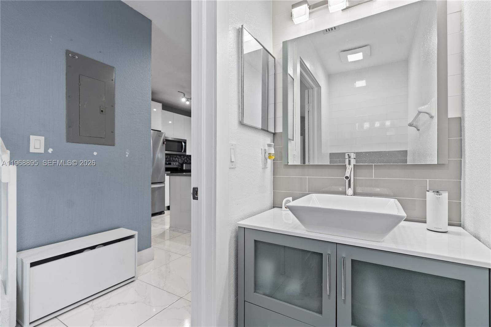 1621 Southeast 30th Street Homestead, FL 33035 - Photo 6 of 20 a kitchen with a sink cabinets and refrigerator