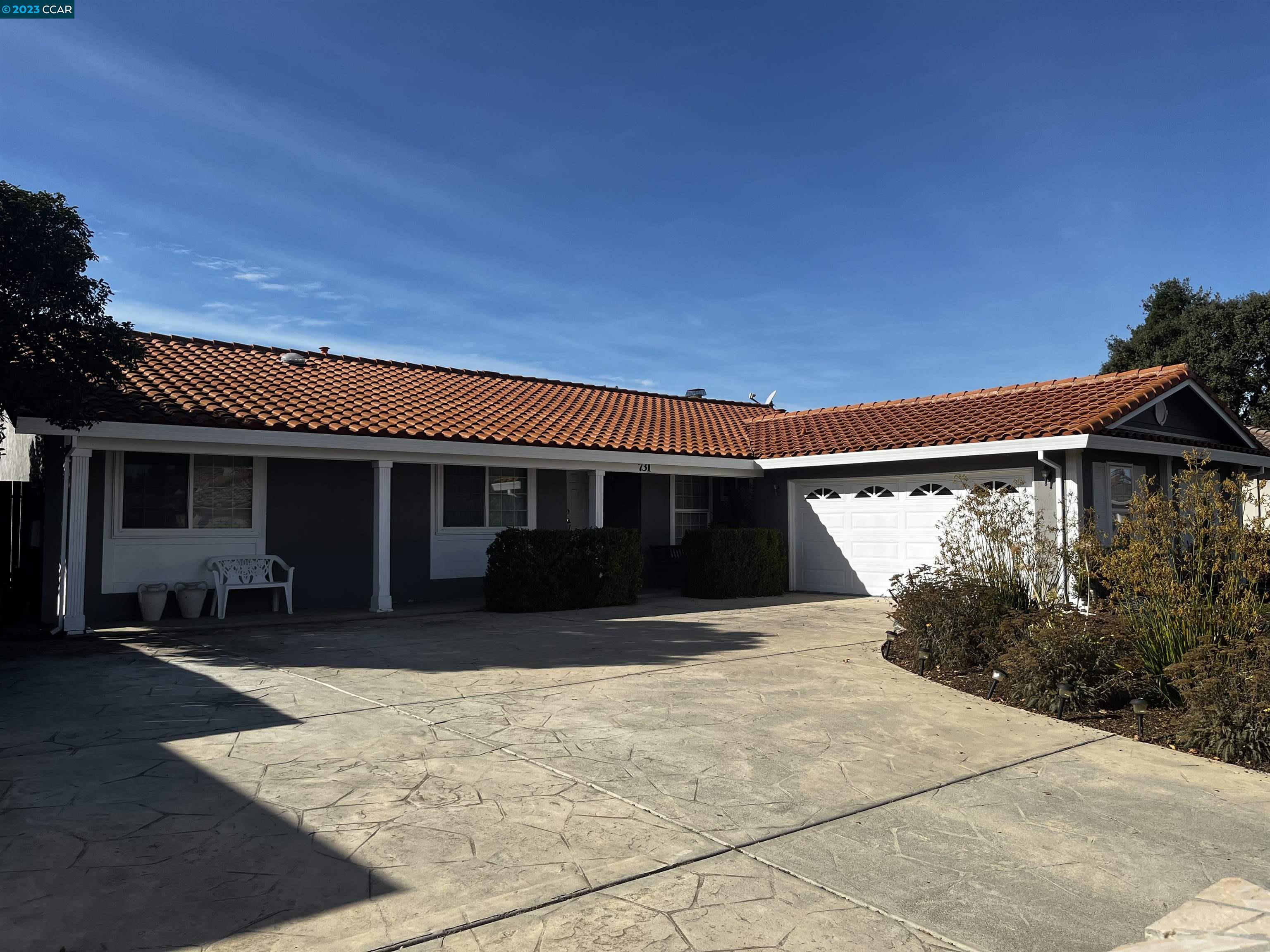 731 Graymont Circle Concord, CA 94518 - Photo 1 of 9 a front view of a house with yard and seating space