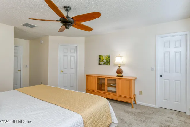 a bathroom with a granite countertop sink a mirror and a bathtub