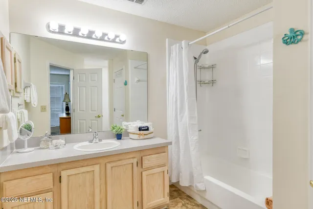 a bathroom with a sink and a shower