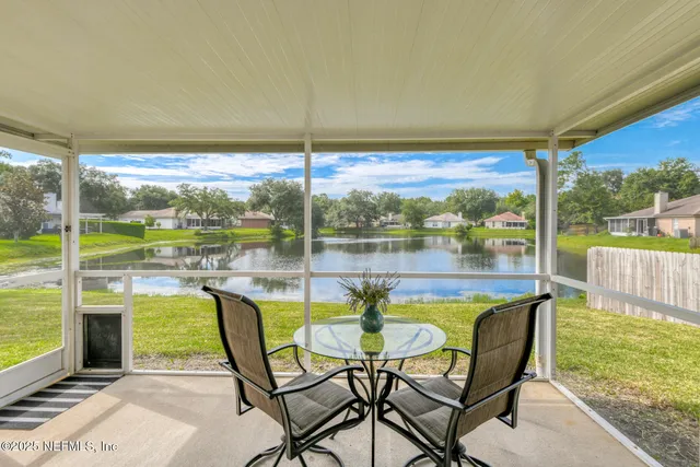 a view of a house with backyard and porch