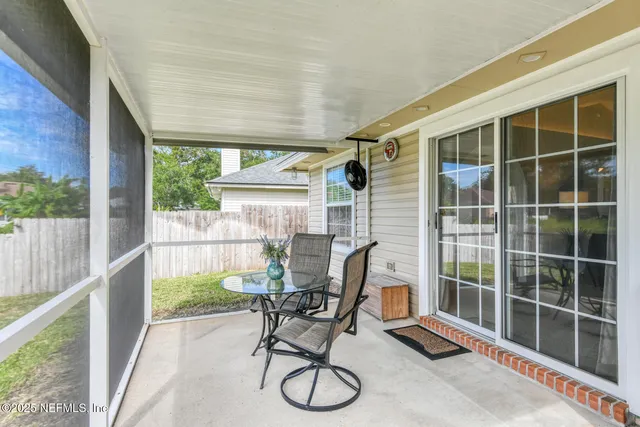 a view of a swimming pool with a patio