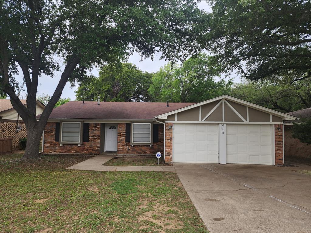 2720 Muse Street Fort Worth, TX 76112 - Photo 1 of 1 a front view of house with yard garage and green space