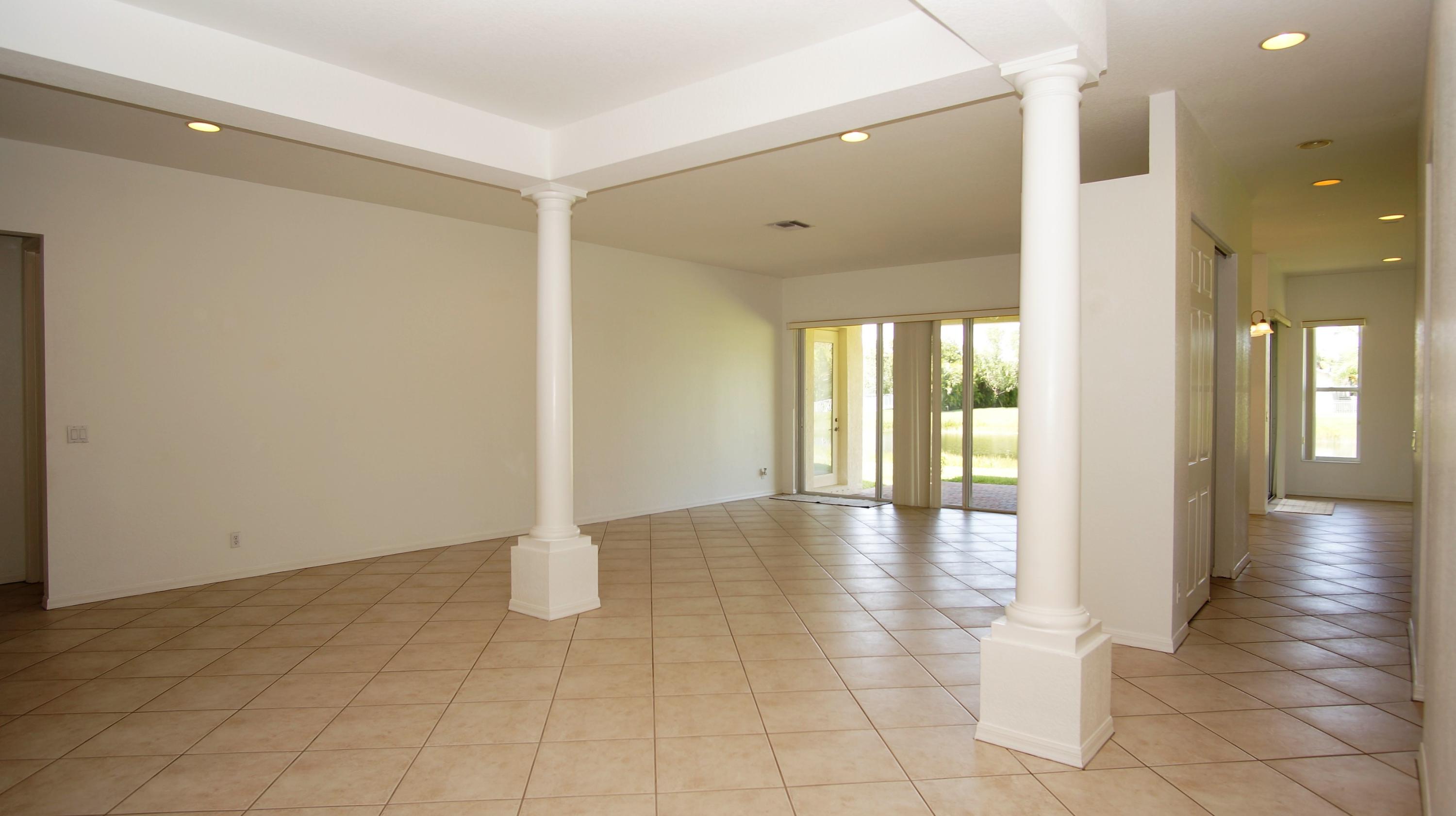 4688 Manderly Drive Wellington, FL 33449 - Photo 25 of 55 a view of a hallway with wooden floor and a bathroom