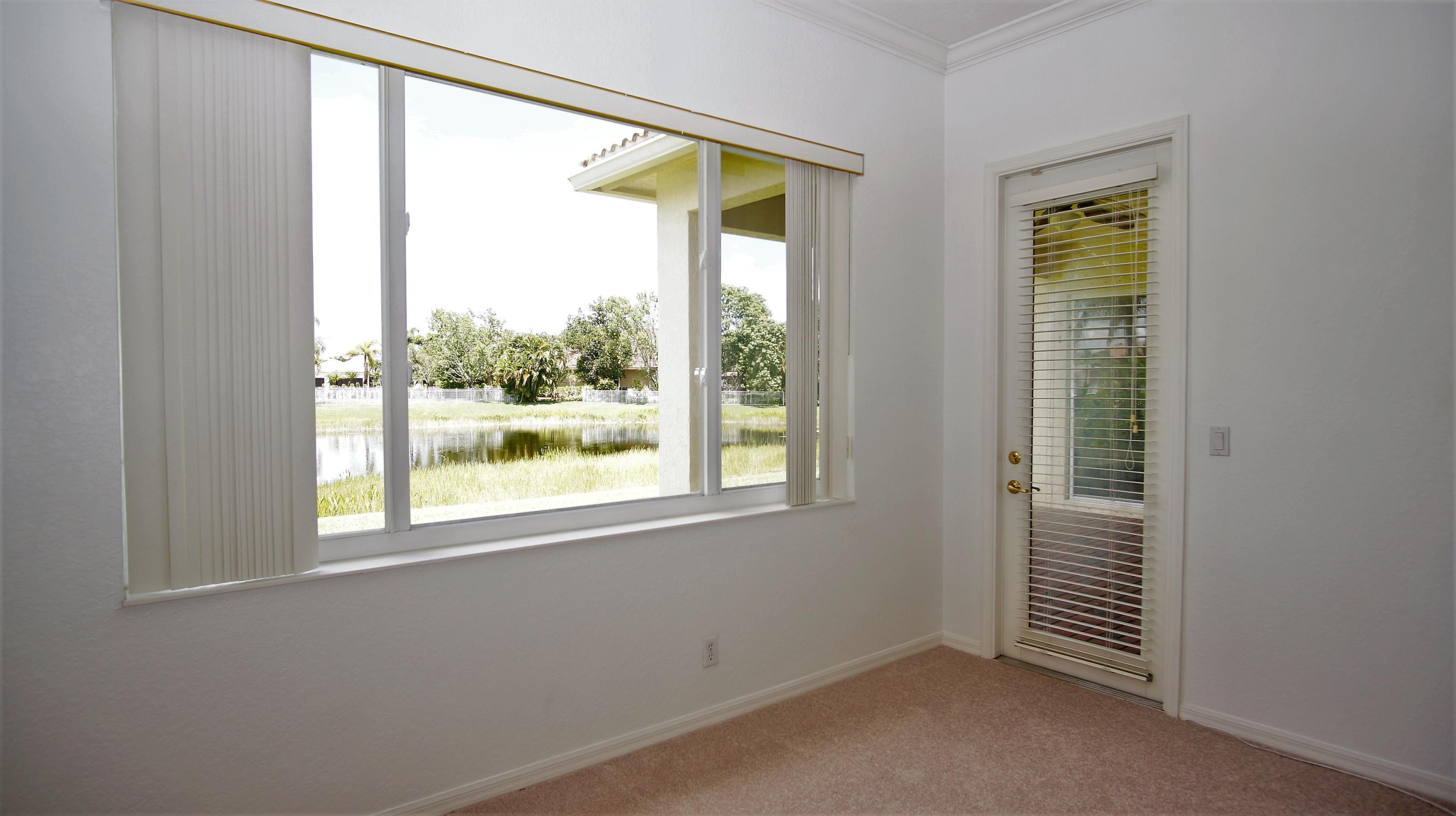 4688 Manderly Drive Wellington, FL 33449 - Photo 28 of 55 a view of an empty room with a window