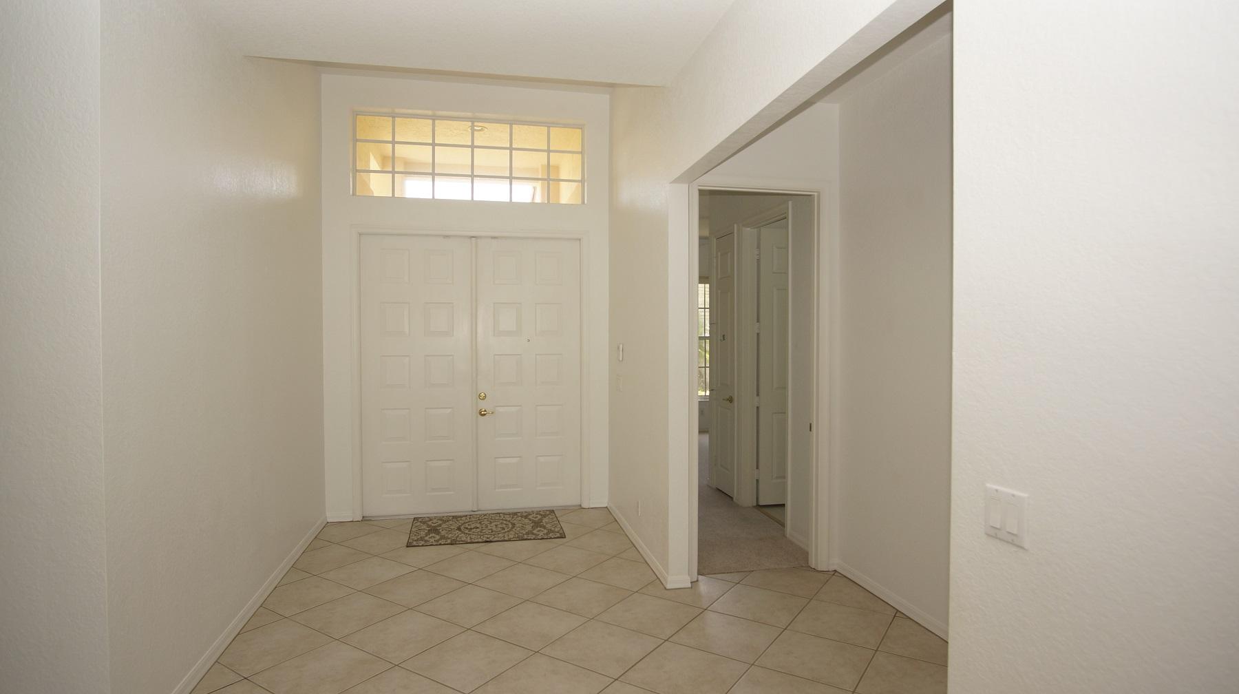 4688 Manderly Drive Wellington, FL 33449 - Photo 30 of 55 an empty room with windows