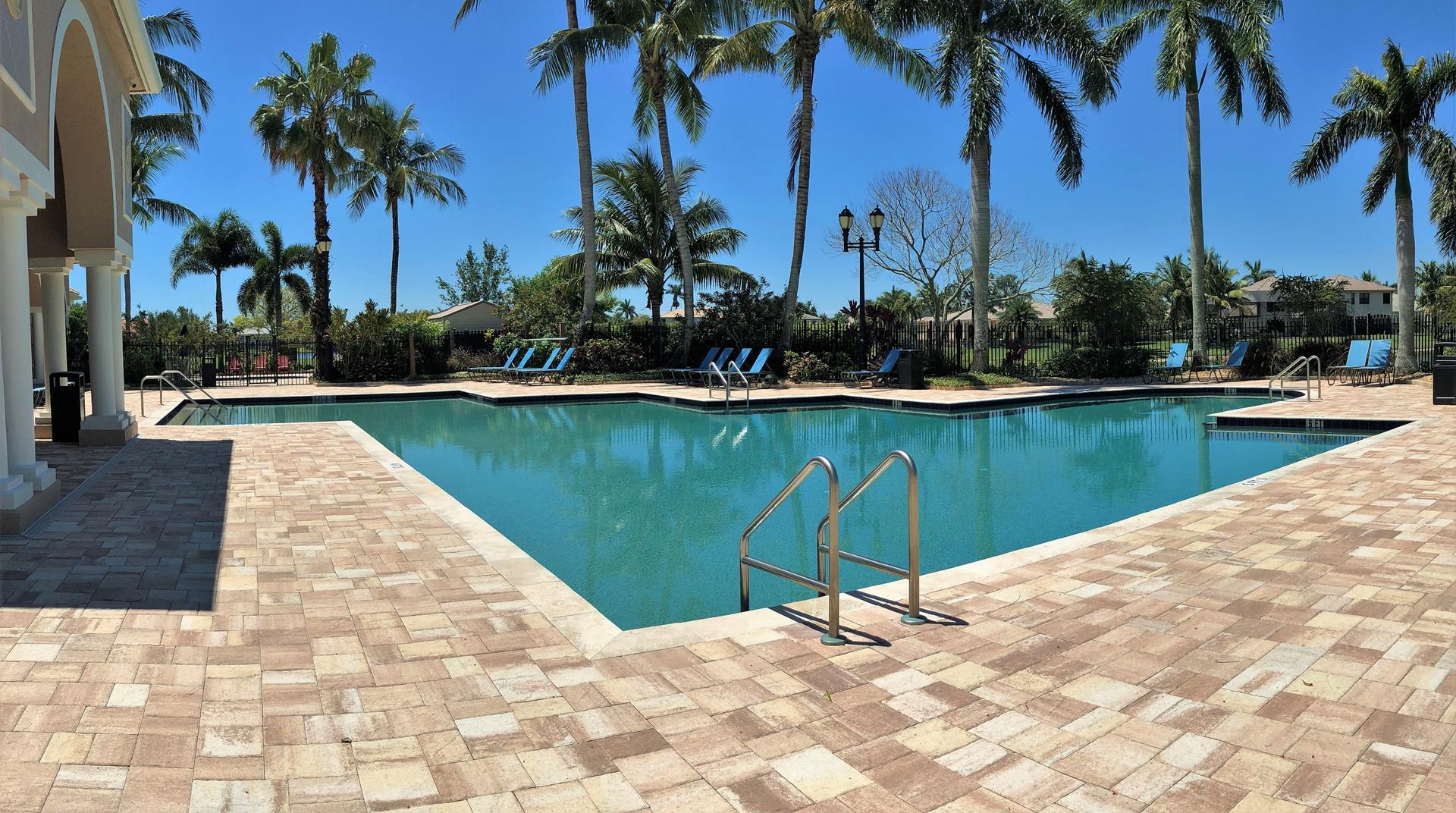 4688 Manderly Drive Wellington, FL 33449 - Photo 47 of 55 a view of a swimming pool and a chair