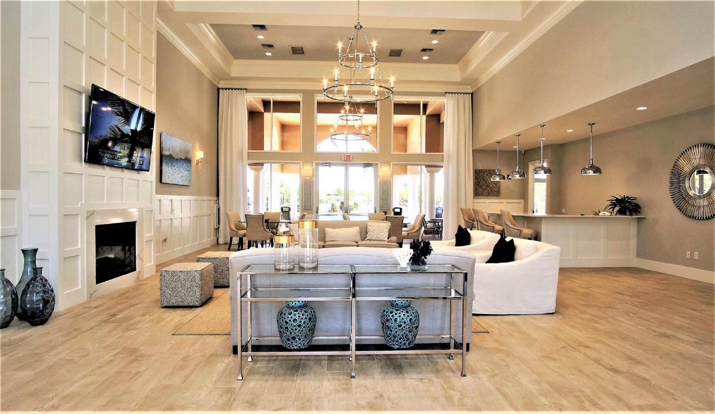 4688 Manderly Drive Wellington, FL 33449 - Photo 50 of 55 a living room with fireplace furniture and a large window