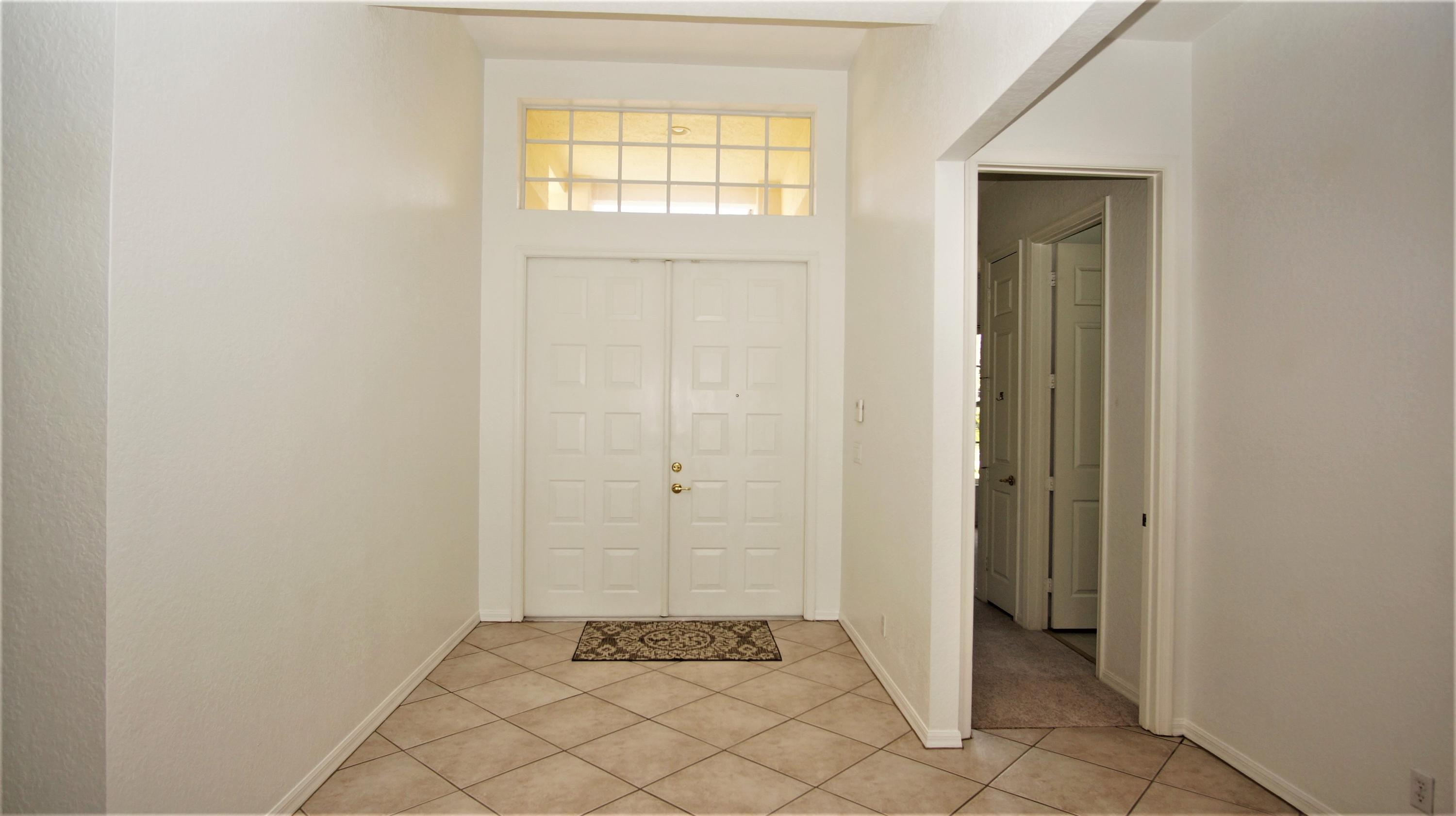 4688 Manderly Drive Wellington, FL 33449 - Photo 6 of 55 an empty room with windows