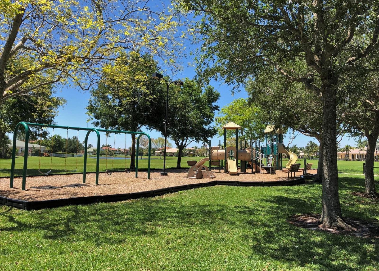 4688 Manderly Drive Wellington, FL 33449 - Photo 53 of 55 a view of yard with green space and trees