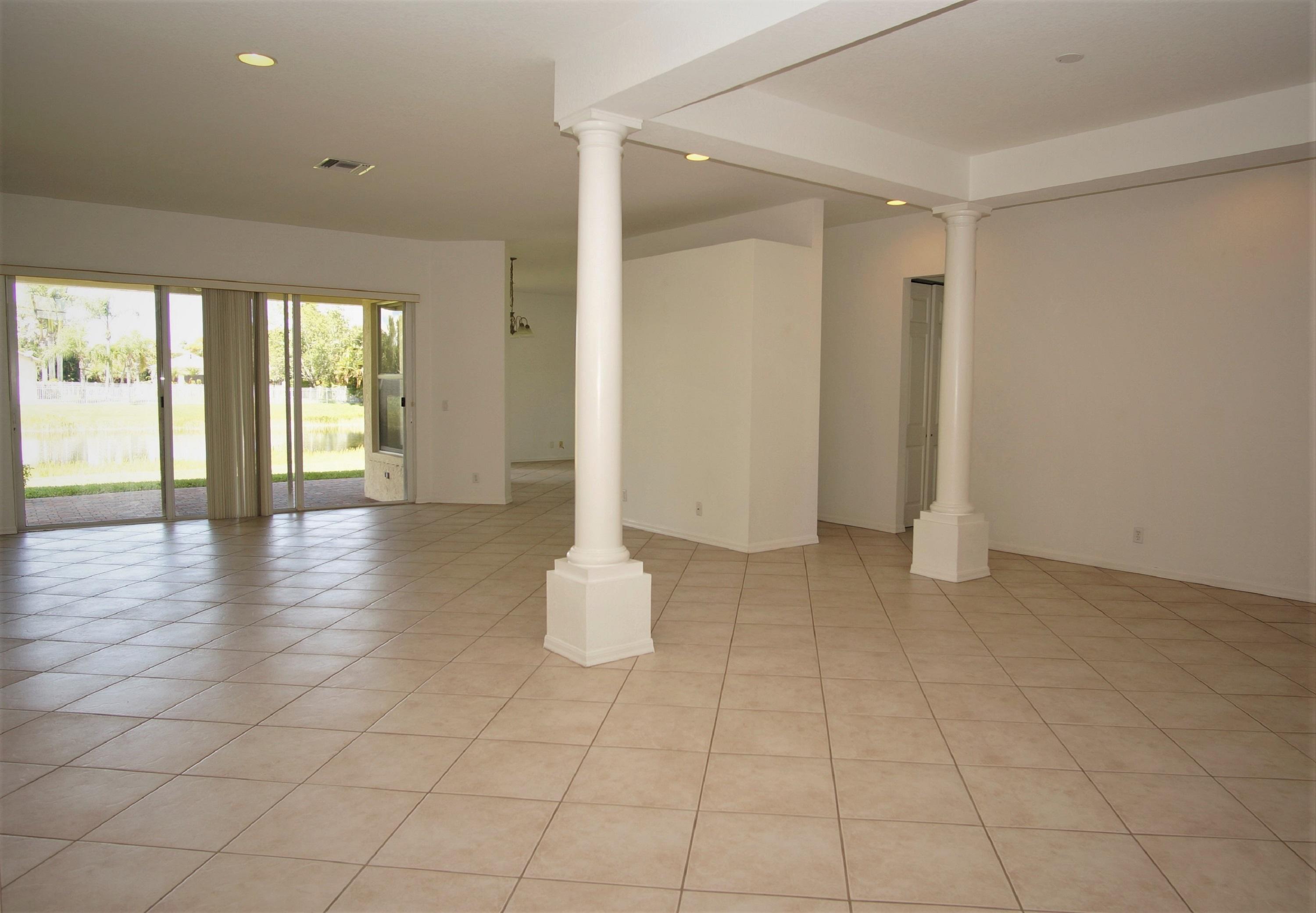 4688 Manderly Drive Wellington, FL 33449 - Photo 7 of 55 a view of an empty room and window