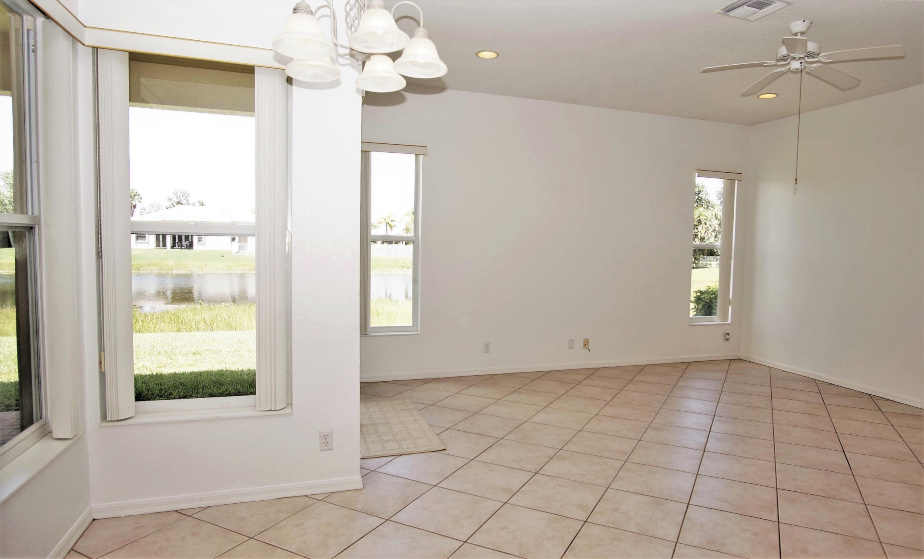 4688 Manderly Drive Wellington, FL 33449 - Photo 10 of 55 an empty room with windows and entrance