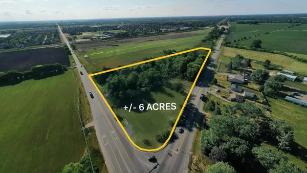 an aerial view of a swimming pool with a mountain view