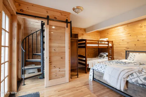 a bedroom with a bed and a walk in closet