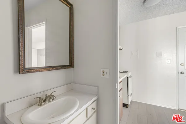 a bathroom with a sink and a mirror