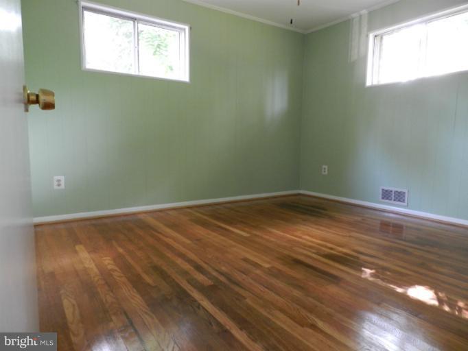 3513 Greenly Street Silver Spring, MD 20906 - Photo 2 of 12 a view of a room with wooden floor and windows