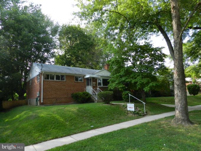 3513 Greenly Street Silver Spring, MD 20906 - Photo 12 of 12 a front view of a house with garden
