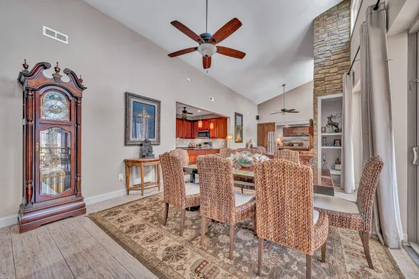 a kitchen with stainless steel appliances granite countertop a refrigerator a stove top oven a sink and dishwasher