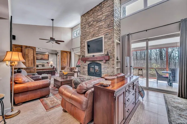 a kitchen with stainless steel appliances granite countertop a sink and a refrigerator